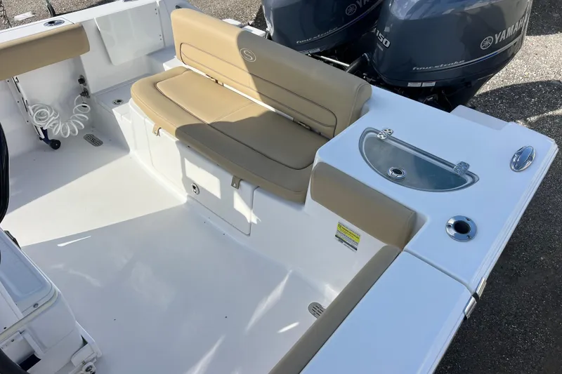 Slide: The Image of 2017 Sportsman Heritage 251 Center Console boat interior with seating and Yamaha engines. - 12