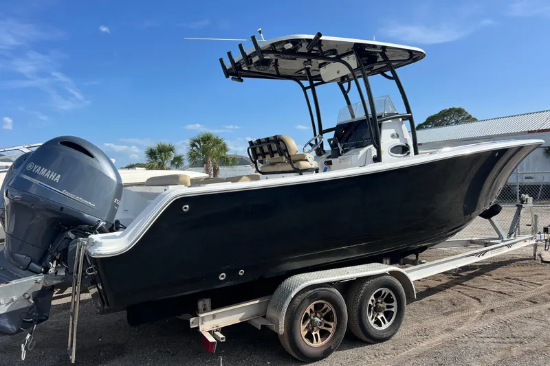 Slide: The Image of 2017 Sportsman Heritage 251 Center Console boat on trailer with Yamaha engine. - 2