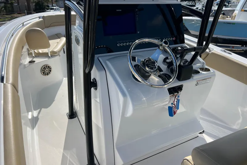 Slide: The Image of 2017 Sportsman Heritage 251 Center Console boat interior with steering wheel and seating. - 5