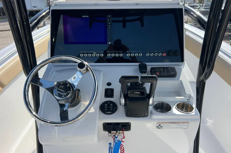 Slide: The Image of 2017 Sportsman Heritage 251 Center Console helm with steering wheel and control panel. - 6