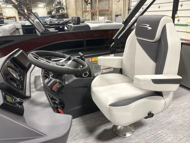 Slide: The Image of Interior of 2026 Bennington 22 S1SB with helm console and captain's chair. - 4