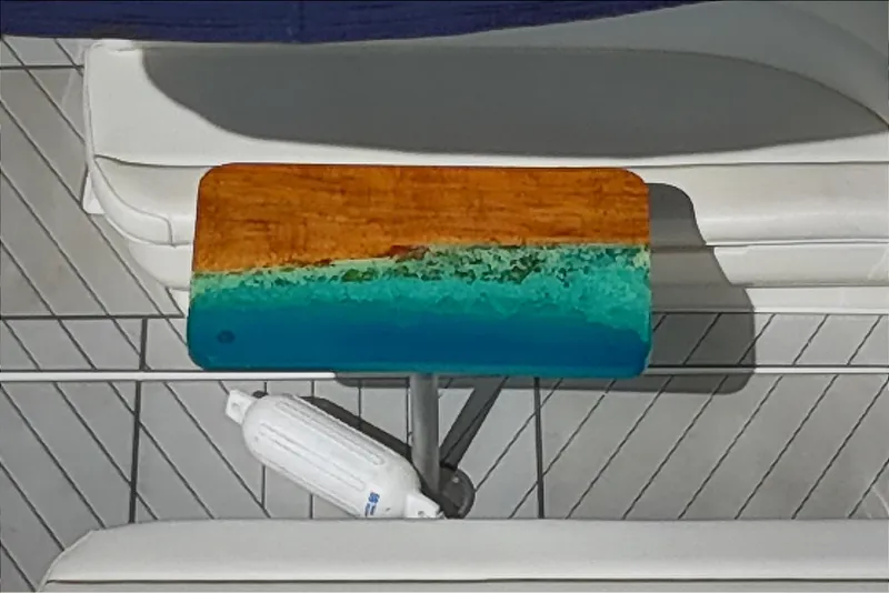 Slide: The Image of Wooden table with ocean-themed resin design on a 2001 Sea Ray 340 Sundancer boat. - 10