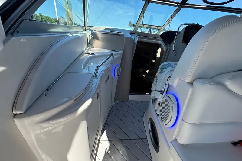 Slide: The Image of Interior of 2001 Sea Ray 340 Sundancer boat with modern seating and blue LED lighting. - 13