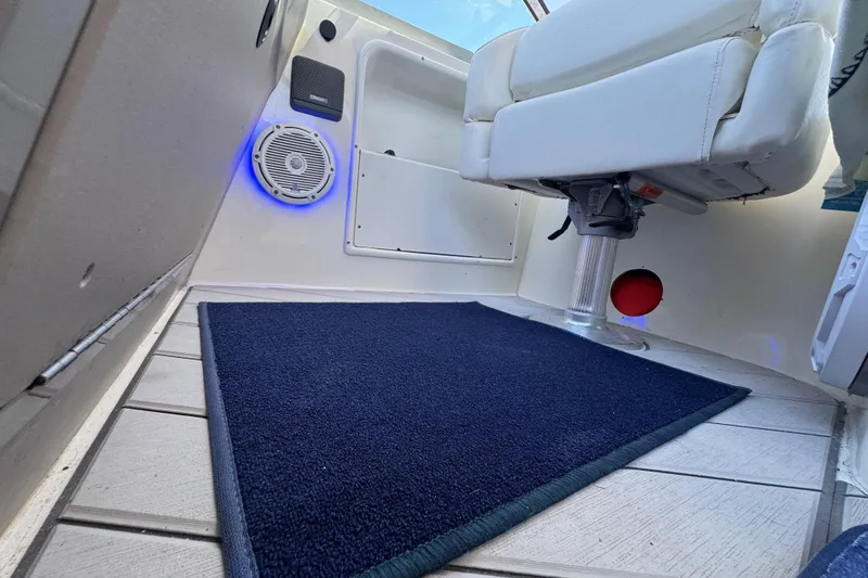 Slide: The Image of Interior of 2001 Sea Ray 340 Sundancer boat with seating and speaker. - 14