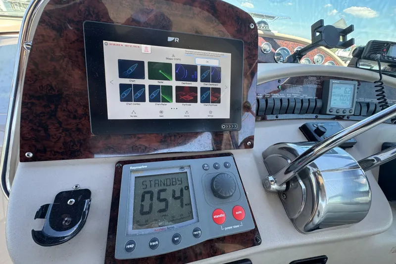 Slide: The Image of Control panel of a 2001 Sea Ray 340 Sundancer boat with navigation equipment. - 19