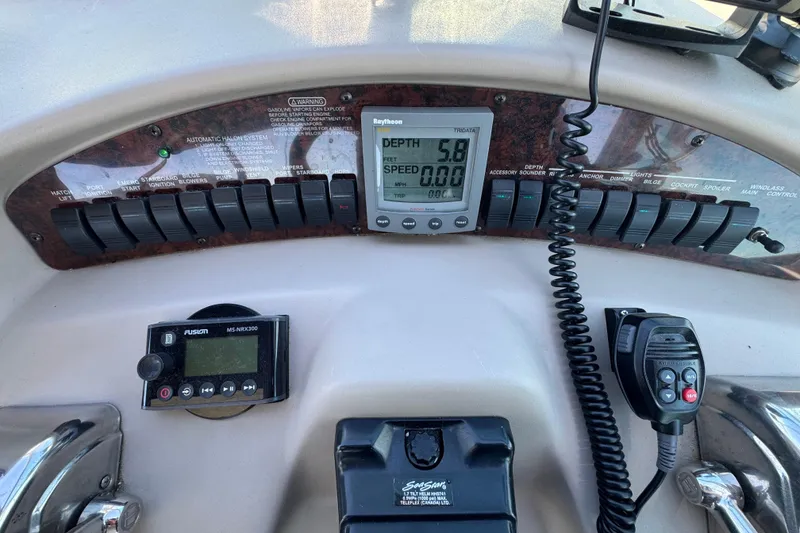 Slide: The Image of Control panel of a 2001 Sea Ray 340 Sundancer boat with depth and speed gauges. - 20