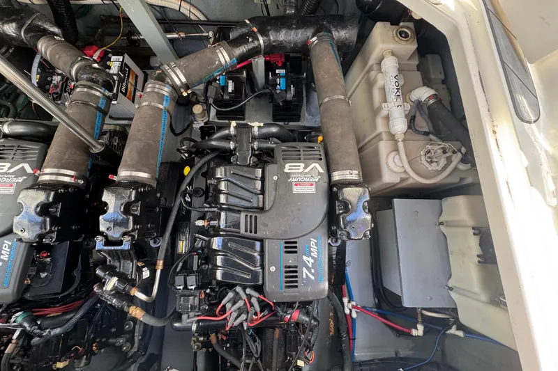 Slide: The Image of Engine compartment of a 2001 Sea Ray 340 Sundancer with V8 Mercury engines. - 35