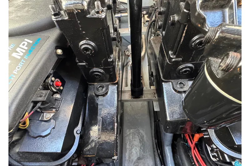 Slide: The Image of Engine compartment of a 2001 Sea Ray 340 Sundancer boat, showcasing mechanical components. - 38