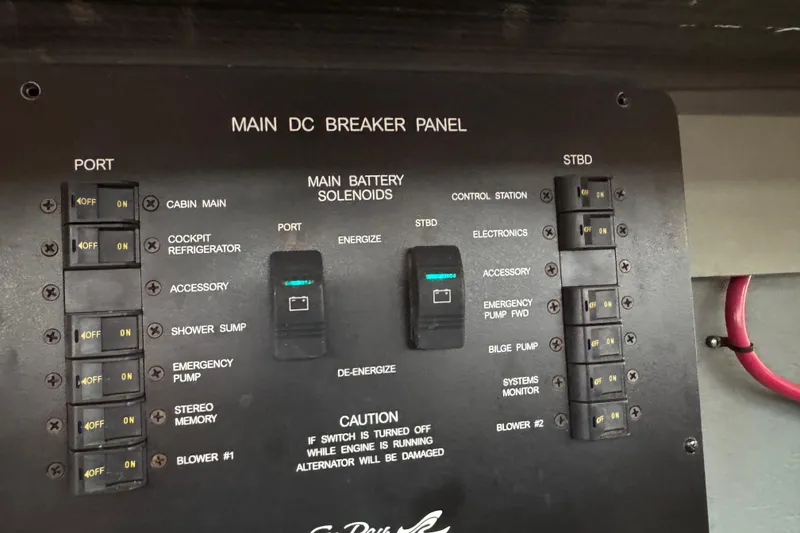 Slide: The Image of Main DC breaker panel of 2001 Sea Ray 340 Sundancer boat with switches and solenoids. - 44