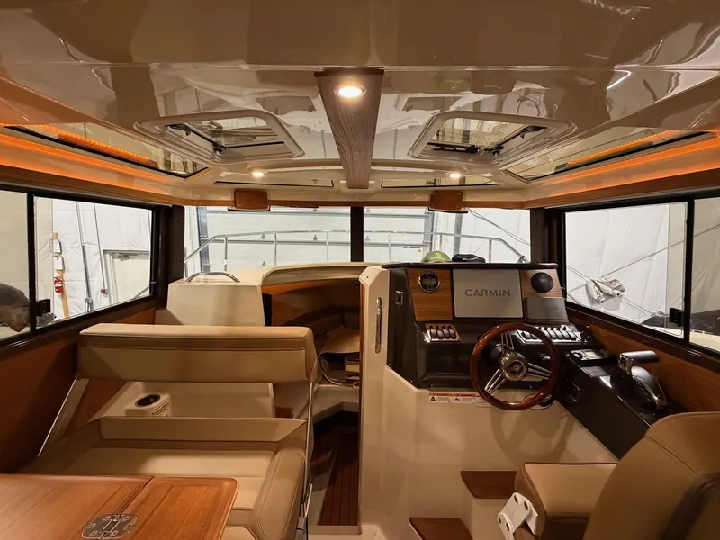 Slide: The Image of Interior of 2023 Ranger Tugs R 25 NW with modern helm console. - 9