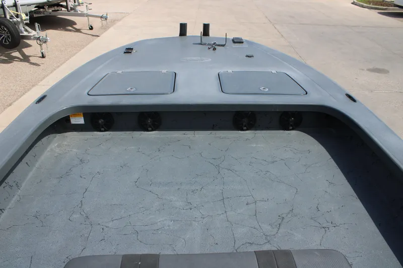 Slide: The Image of 2022 Majek 24 Reaper boat deck with storage compartments and speakers. - 13