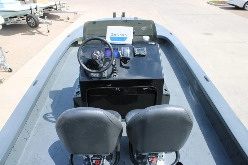 Slide: The Image of 2022 Majek 24 Reaper boat interior with Garmin navigation system and dual seats. - 14