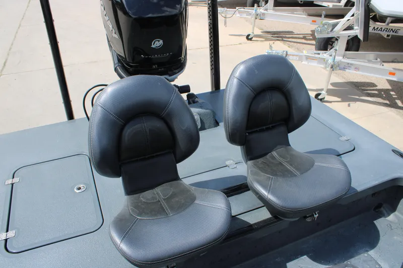 Slide: The Image of Two black seats on a 2022 Majek 24 Reaper boat deck. - 15