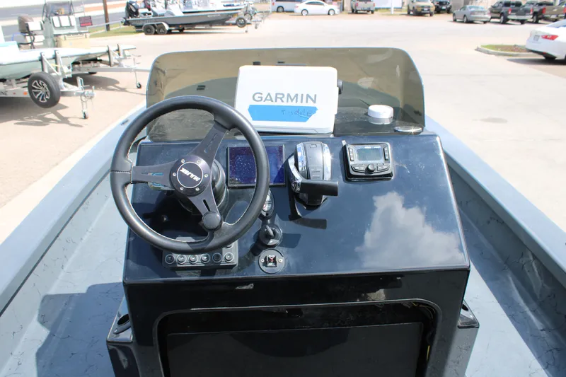 Slide: The Image of Console of a 2022 Majek 24 Reaper boat with Garmin navigation system. - 17