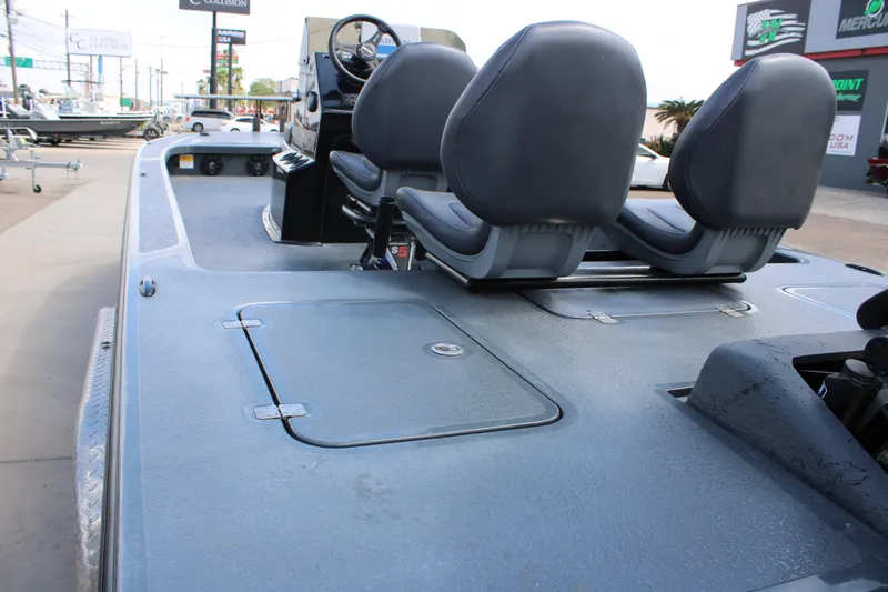 Slide: The Image of 2022 Majek 24 Reaper boat interior with dual seats and storage compartments. - 7