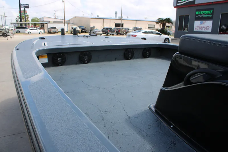 Slide: The Image of 2022 Majek 24 Reaper boat interior with spacious deck and seating. - 9