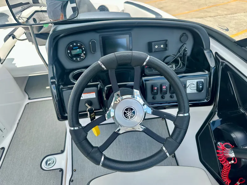 Slide: The Image of Yamaha AR195 2022 boat dashboard with steering wheel and controls. - 10
