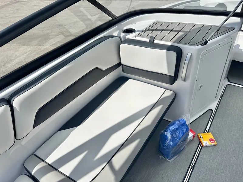 Slide: The Image of Interior of a 2022 Yamaha AR195 boat with seating area. - 14