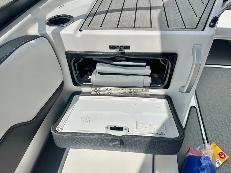 Slide: The Image of Yamaha AR195 2022 boat with open storage compartment and accessories. - 17