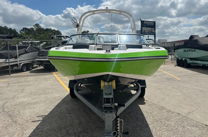 Slide: The Image of 2022 Yamaha AR195 boat in vibrant green on a trailer. - 4