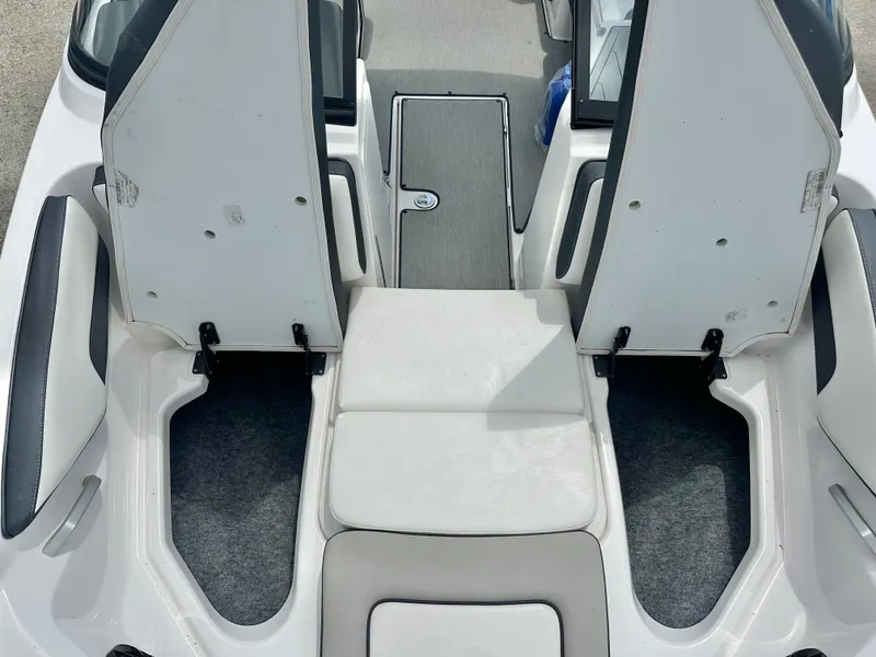 Slide: The Image of Interior of a 2022 Yamaha AR195 boat with open storage compartments. - 7