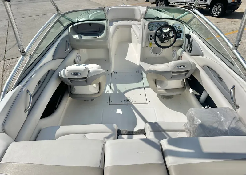 Slide: The Image of Interior of a 2008 Chaparral 210 SSi boat with white upholstery. - 12