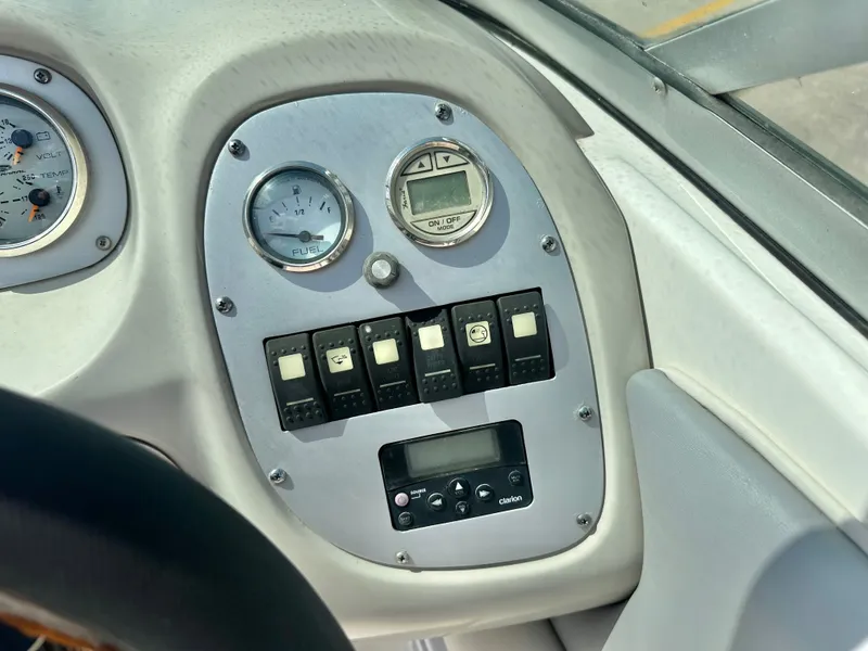 Slide: The Image of Dashboard of a 2008 Chaparral 210 SSi boat with switches and gauges. - 16