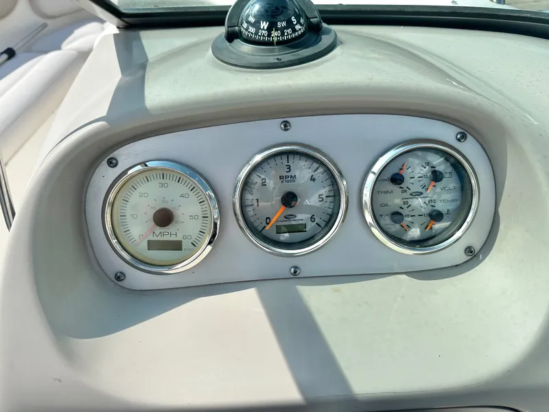 Slide: The Image of Dashboard of a 2008 Chaparral 210 SSi boat with compass. - 17
