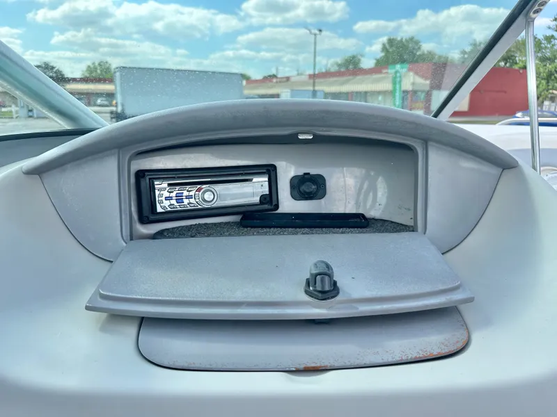 Slide: The Image of 2008 Chaparral 210 SSi dashboard with radio and storage compartment. - 21