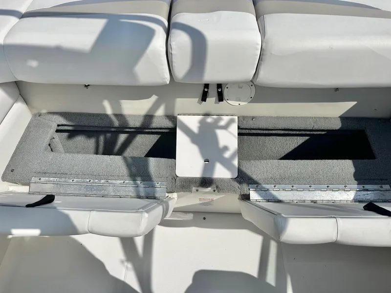 Slide: The Image of Interior of a 2008 Chaparral 210 SSi boat with seating area. - 24