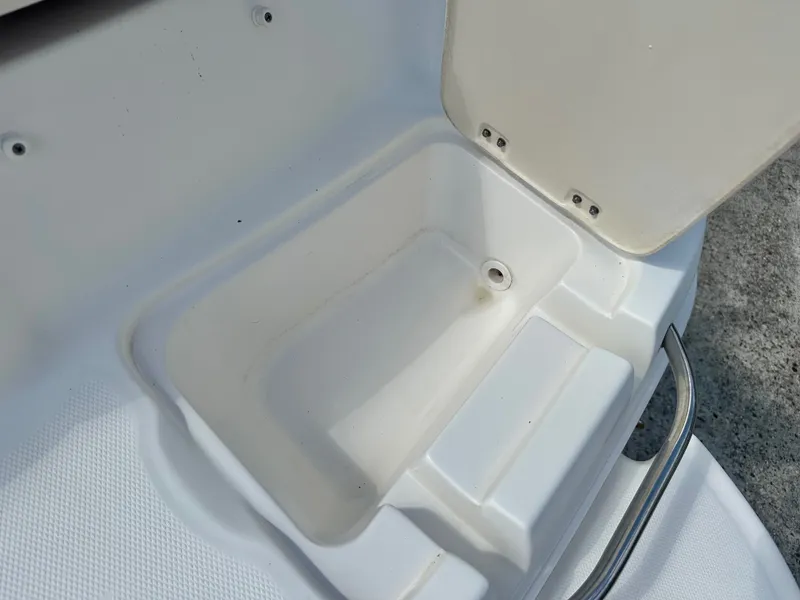 Slide: The Image of Interior of a 2008 Chaparral 210 SSi boat with storage compartment. - 27