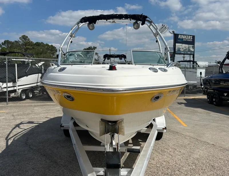 Slide: The Image of 2008 Chaparral 210 SSi boat on trailer, yellow and white, at Rinkers Boat World. - 3