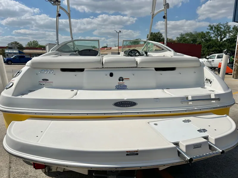 Slide: The Image of Rear view of a 2008 Chaparral 210 SSi boat under blue sky. - 4