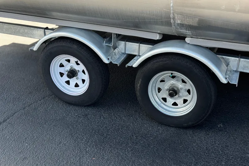 Slide: The Image of Trailer wheels of a 2022 Bennington SX23 Salt Water Series boat. - 25