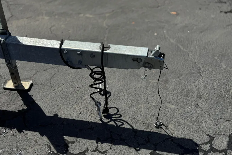 Slide: The Image of Trailer hitch of a 2022 Bennington SX23 Salt Water Series on asphalt. - 26