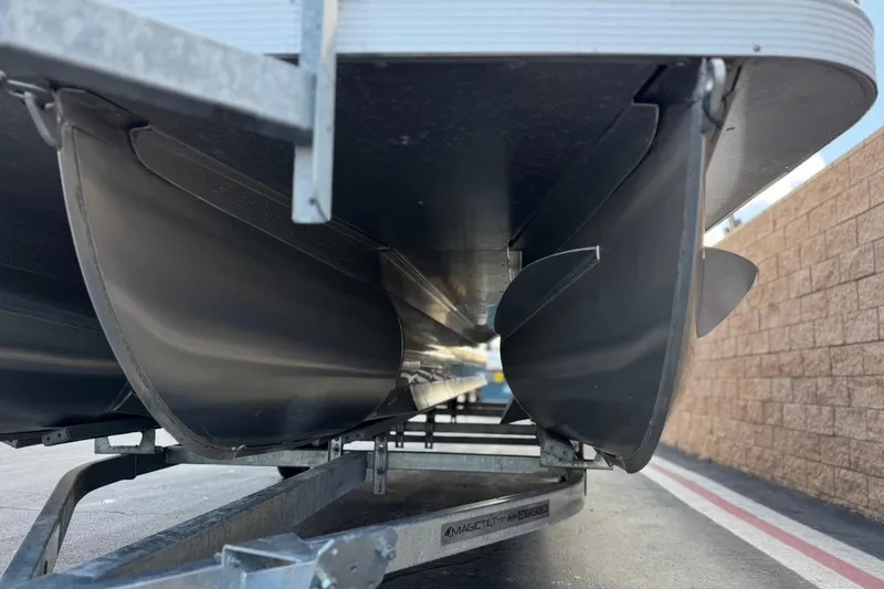 Slide: The Image of Underneath view of a 2022 Bennington SX23 Salt Water Series pontoon boat on a trailer. - 4
