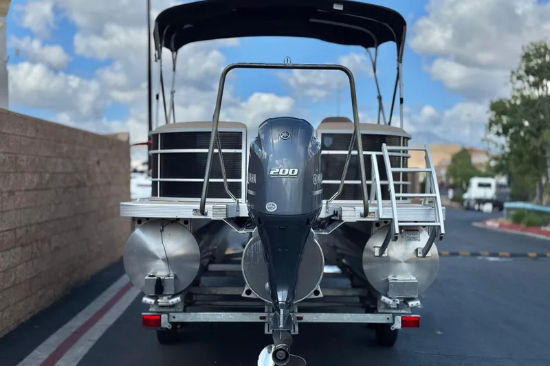 Slide: The Image of 2022 Bennington SX23 Salt Water Series pontoon boat with Yamaha 200 engine on trailer. - 5