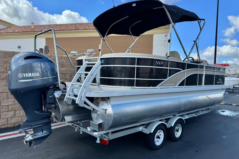 Slide: The Image of 2022 Bennington SX23 Salt Water Series pontoon boat with Yamaha outboard motor on trailer. - 6
