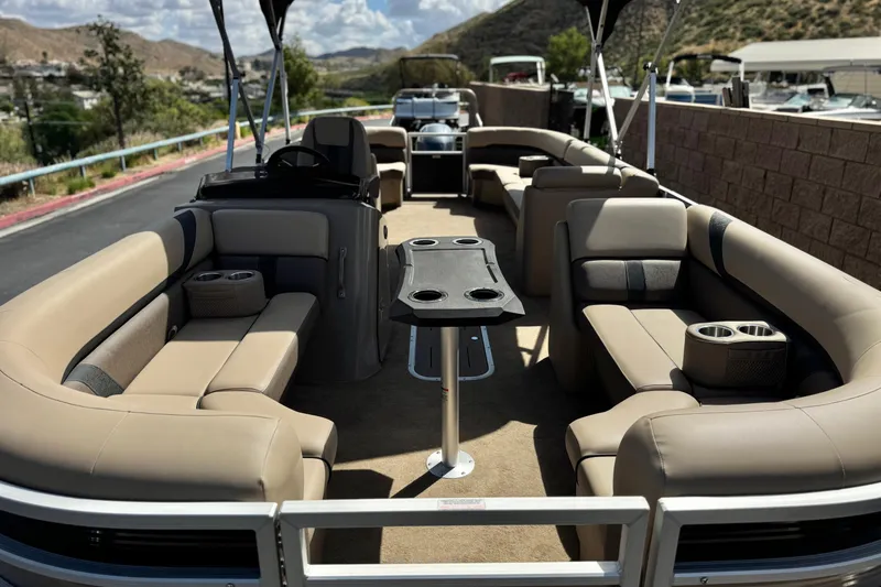 Slide: The Image of 2022 Bennington SX23 Salt Water Series pontoon boat with spacious seating and cup holders. - 9