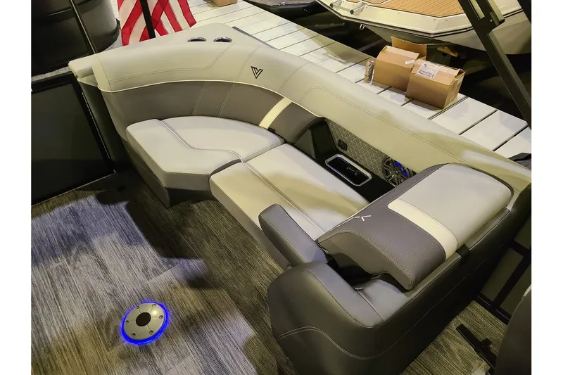 Slide: The Image of Interior of 2026 Viaggio Lago Z22U Tritoon with luxurious seating. - 12