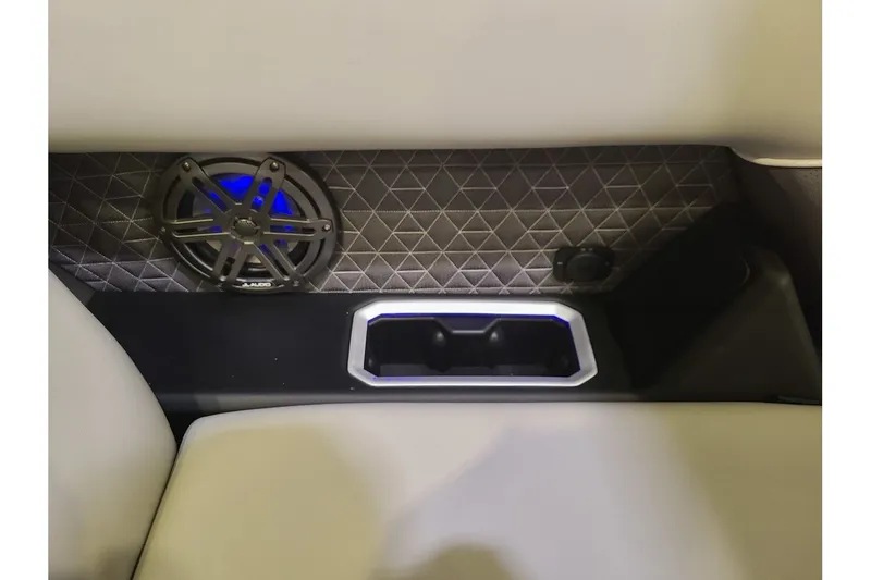 Slide: The Image of Interior of Viaggio Lago Z22U Tritoon with speaker and cup holder. - 22