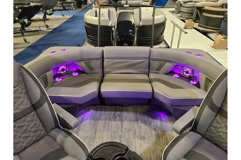 Slide: The Image of Interior of 2026 Viaggio Diamante 24Q Tritoon with purple LED lighting. - 10