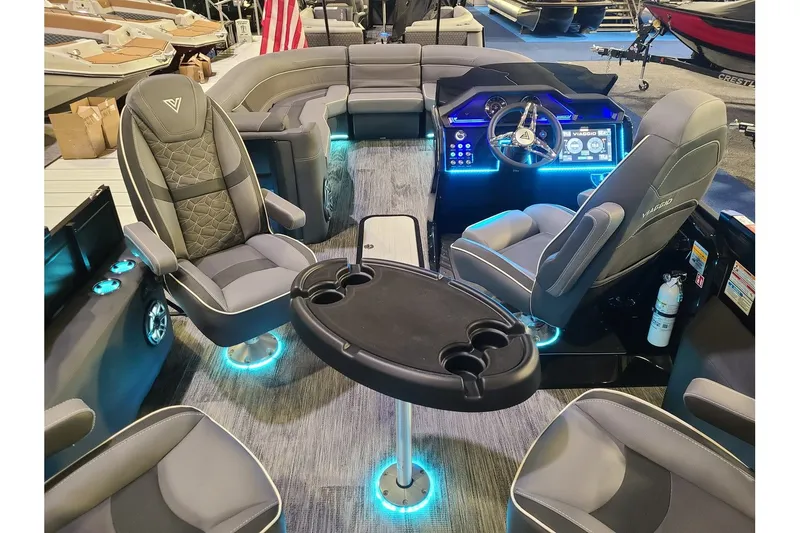 Slide: The Image of Interior of 2026 Viaggio Diamante 24Q Tritoon with luxurious seating and LED lighting. - 12