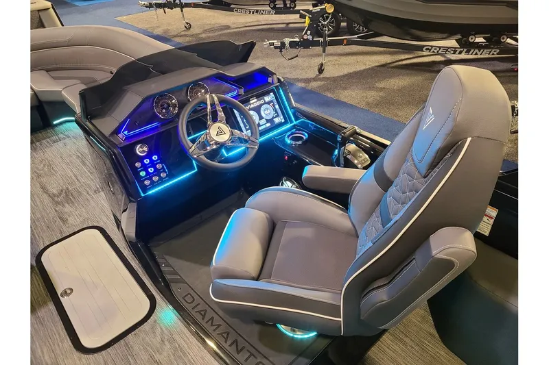 Slide: The Image of Interior of 2026 Viaggio Diamante 24Q Tritoon with illuminated dashboard. - 15