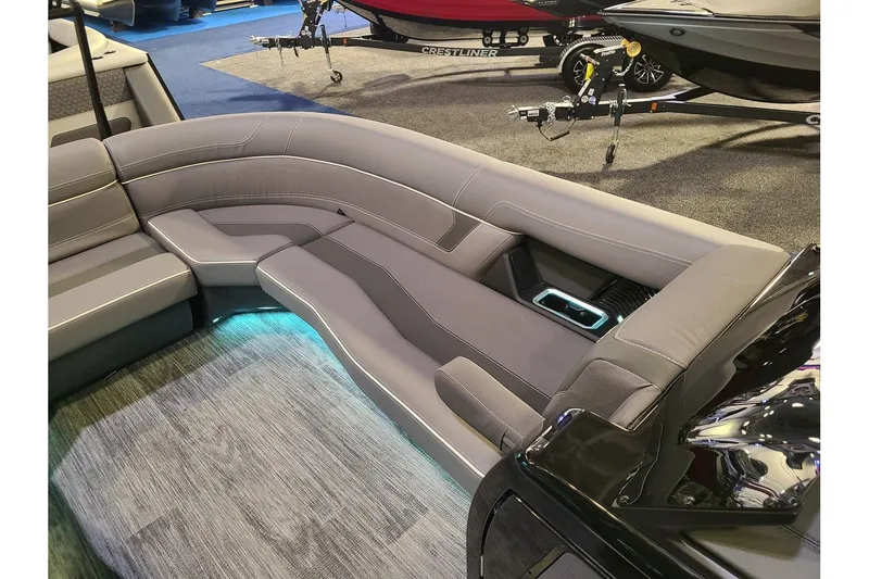 Slide: The Image of Interior of 2026 Viaggio Diamante 24Q Tritoon with sleek gray seating. - 22