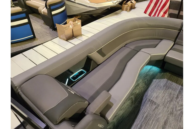 Slide: The Image of Interior of 2026 Viaggio Diamante 24Q Tritoon with luxurious seating. - 23