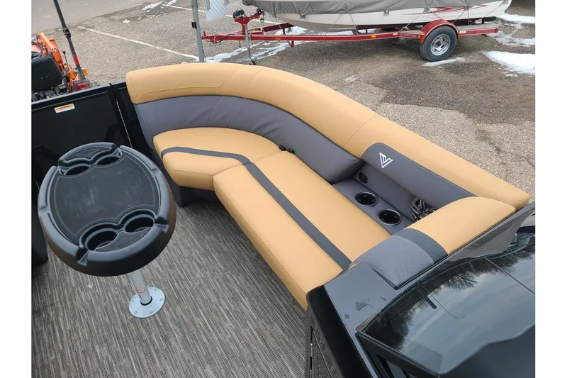 Slide: The Image of Viaggio Lago X22Q 2026 boat with beige and gray seating area. - 19