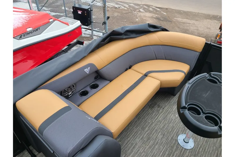 Slide: The Image of Viaggio Lago X22Q 2026 boat seating with cup holders and table. - 20