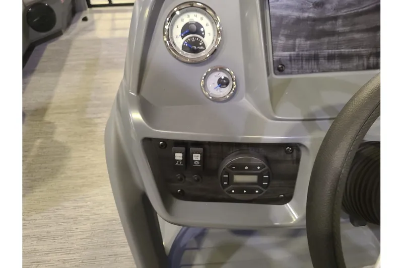 Slide: The Image of Dashboard of 2026 Starcraft GX 20 R DH with controls and gauges. - 15