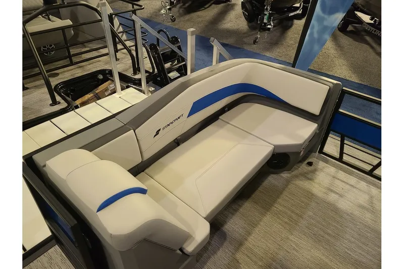 Slide: The Image of Interior of 2026 Starcraft GX 20 R DH with beige and blue seating. - 18